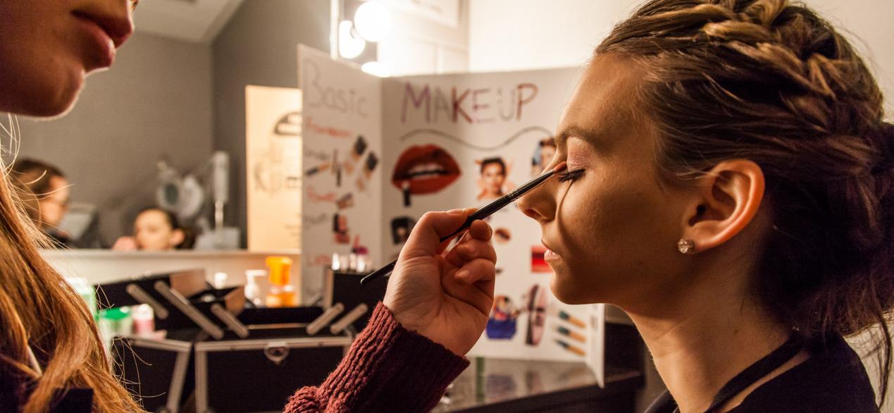 Image of student applying makeup