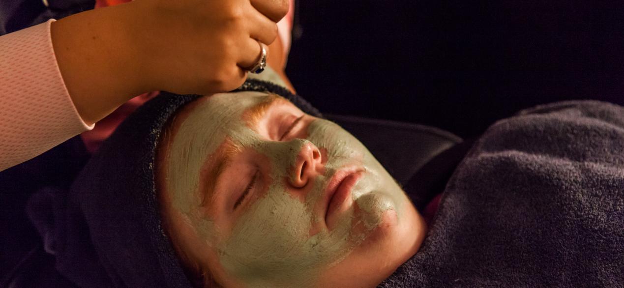Image of student giving a facial