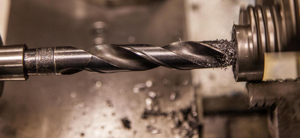 Image of a drill cutting metal
