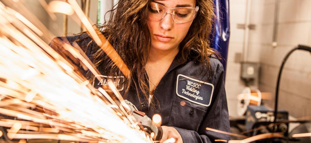 Image of a girl using a grinder