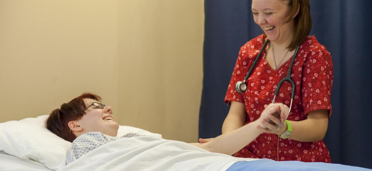 Image of student taking a patient's pulse