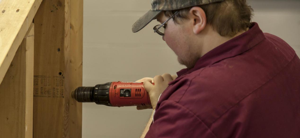 Image of student using a power tool