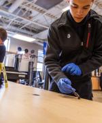 Image of students inspecting a fake crime scene 