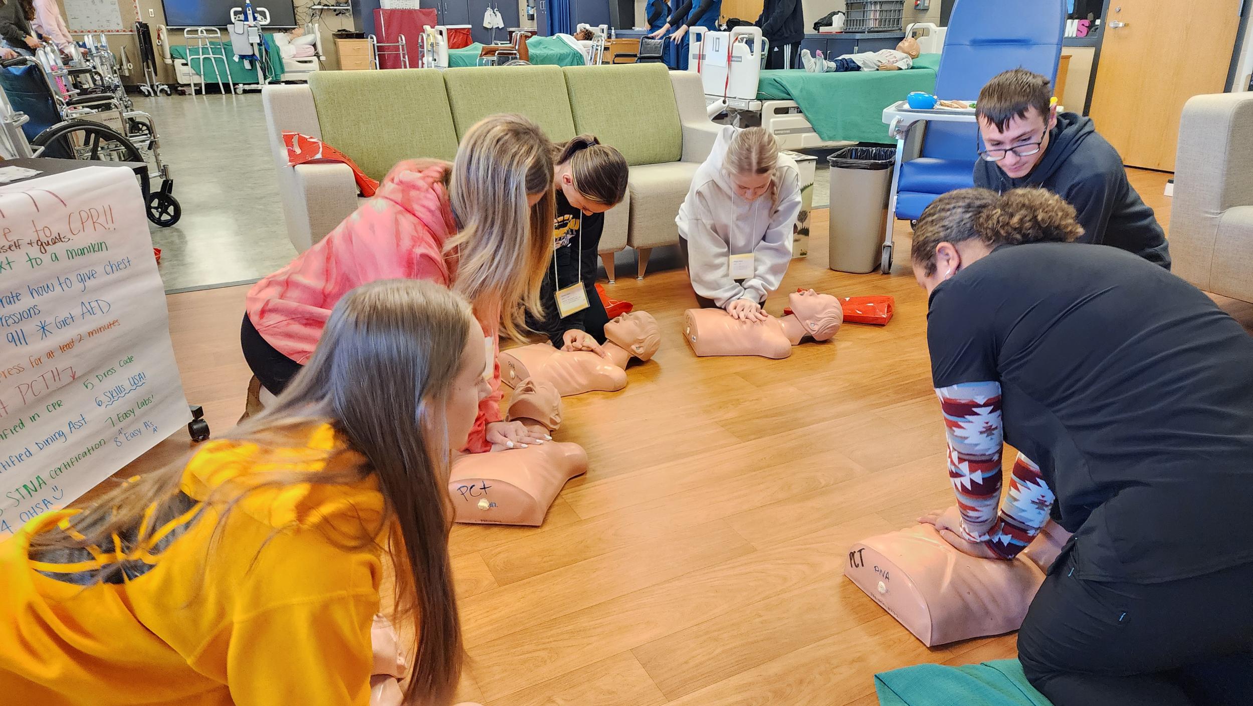 Sophomore visitors try their hand at CPR in Patient Care Technologies Sophomore visitors try their hand at CPR in Patient Care Technologies