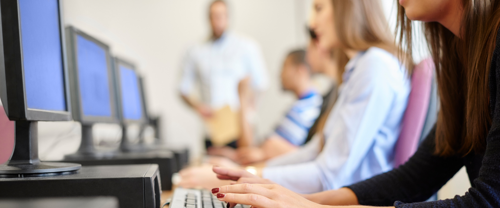 A women at a computer typing