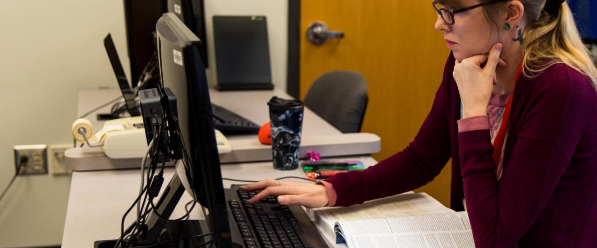 Woman at a computer typing