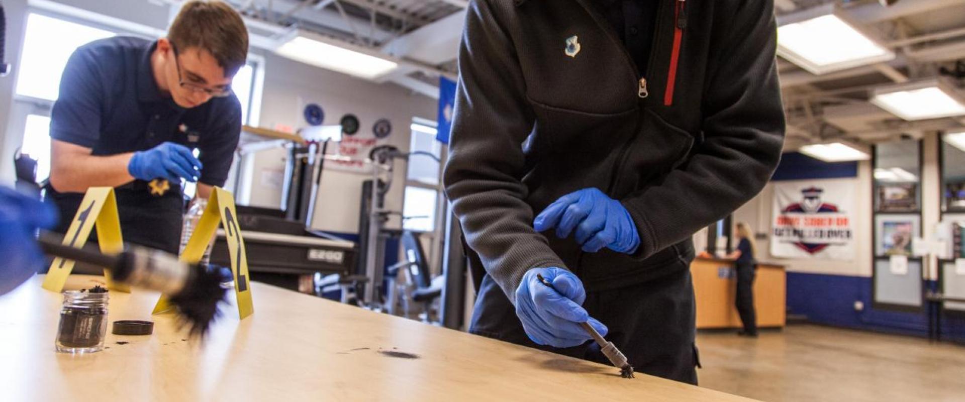 Students dusting for fingerprints