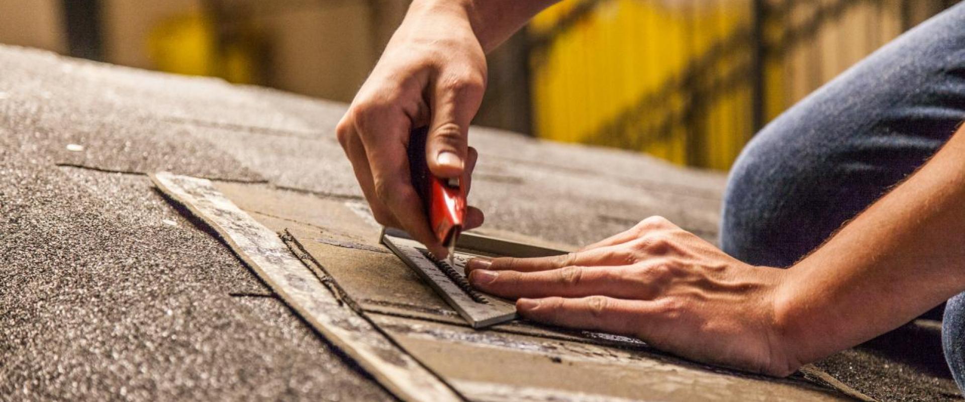 Image of a student cutting shingles