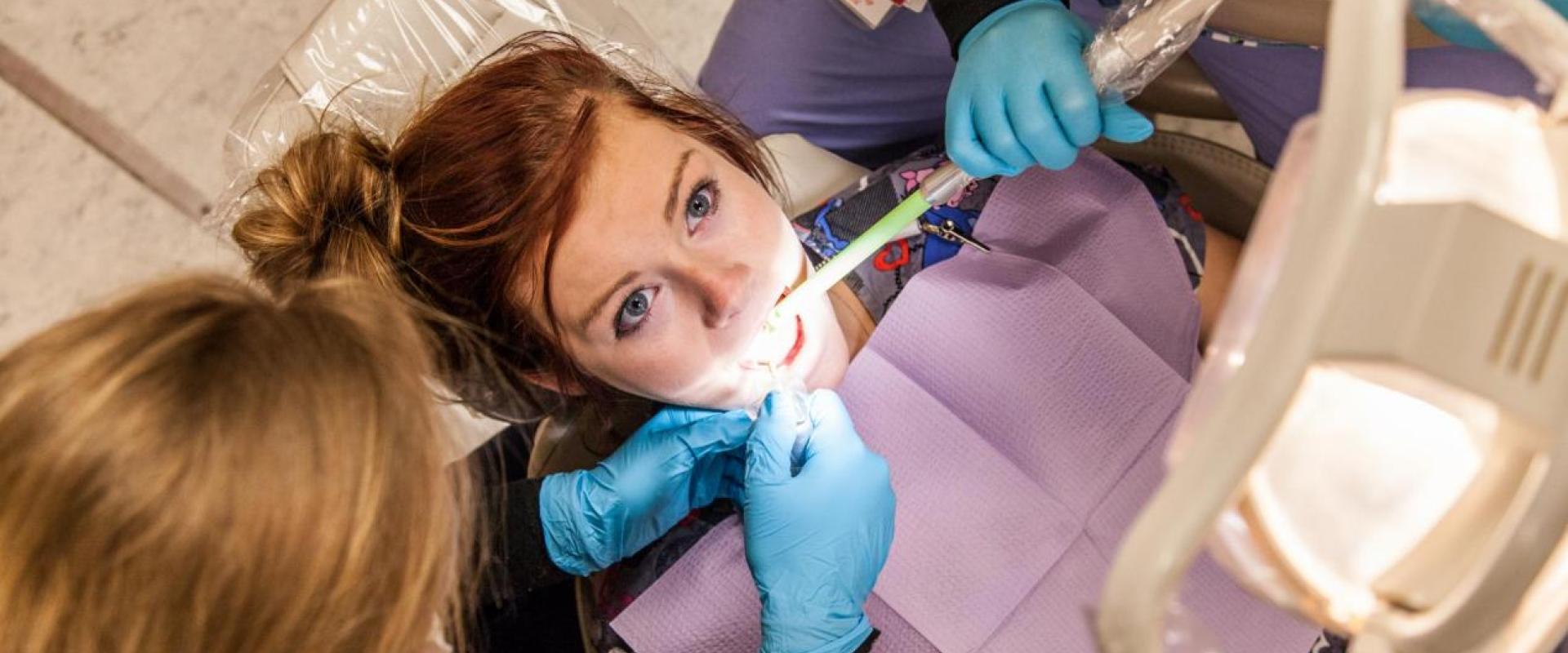 A patient getting teeth examined