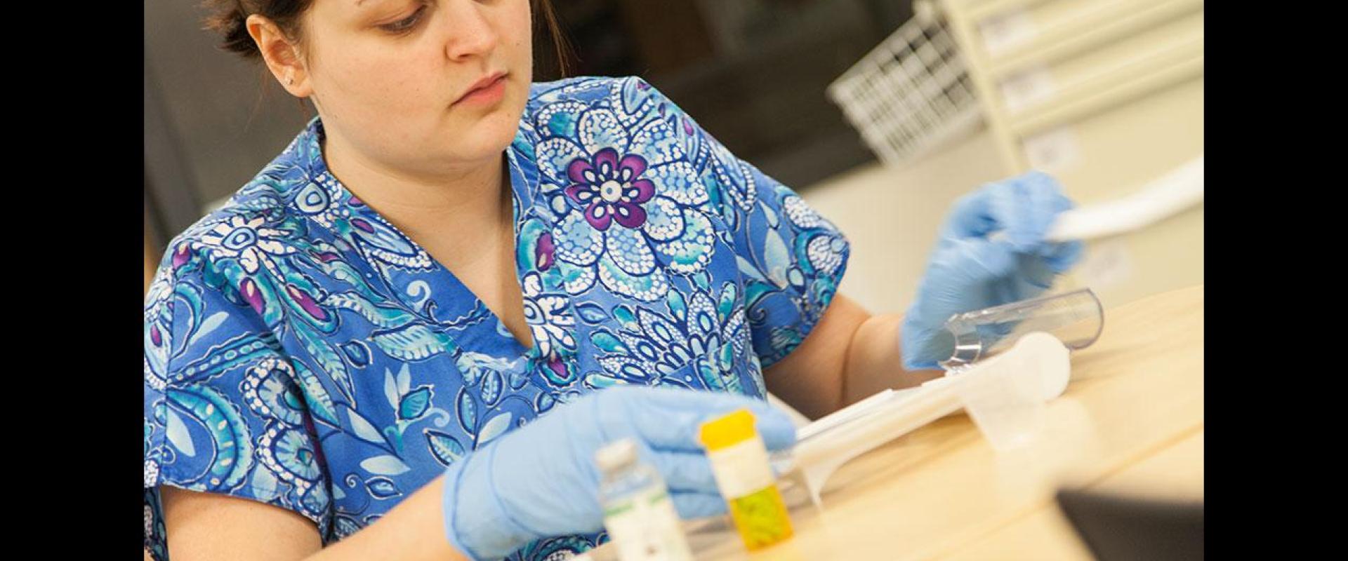 Nurse evaluating medical equipment