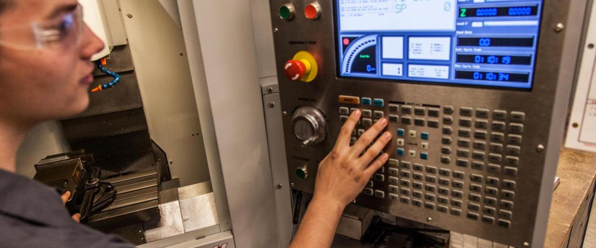 A male selecting buttons on a machine