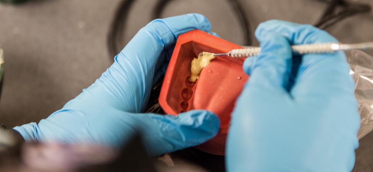 Image of student making dental mold