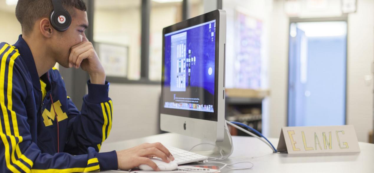 Image of a student designing object on a laptop 