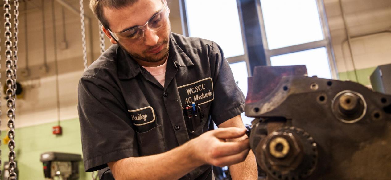 Image of student working on motor