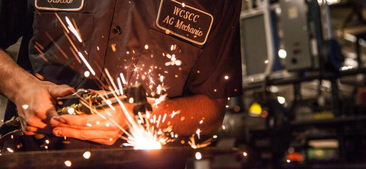 Image of student using grinder