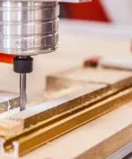 Industrial machine shaving down metal.