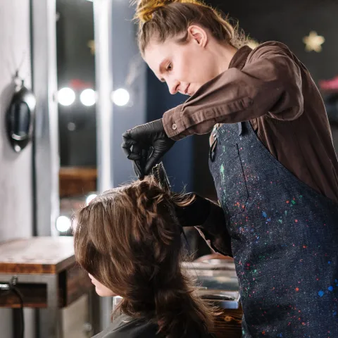 person cutting hair