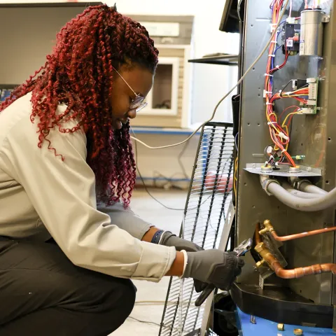 hvac student working 