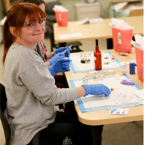 nursing student wearing gloves